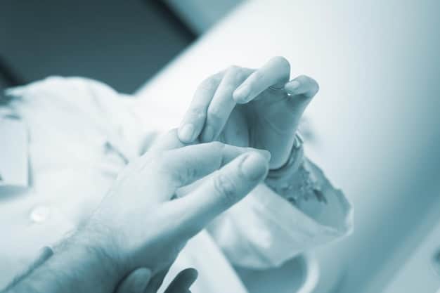 A close-up photograph of a doctor's hands holding a newborn baby, blurred in the background are medical instruments, symbolizing the sanctity of life from a medical perspective.