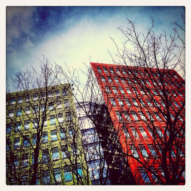 A split image showing two contrasting scenes: on one side, a thriving urban center with clean energy initiatives like solar panels and electric vehicles; on the other side, a struggling community facing environmental challenges like deforestation and pollution. This highlights potential futures depending on decisions made in the upcoming elections.