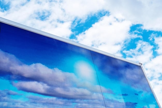 Close-up of a solar panel reflecting the sky, symbolizing clean energy and sustainability.