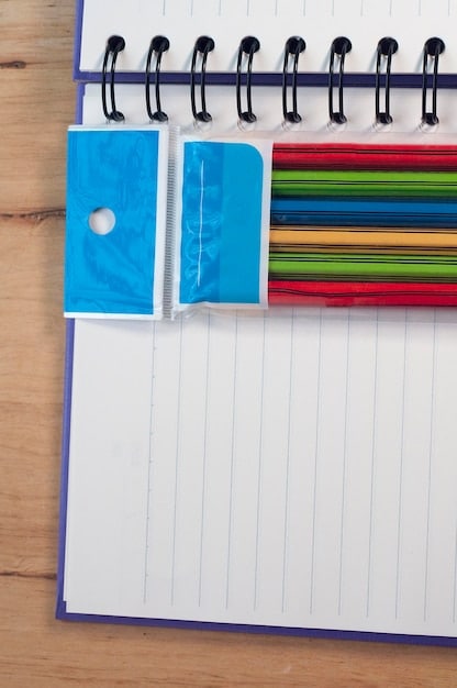 Close-up of a student's planner, filled with handwritten notes, color-coded sections for different subjects, and highlighted important dates. The planner sits on a desk with scattered textbooks and study materials.