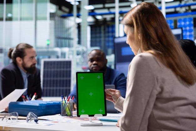 A diverse team of professionals collaborating on a renewable energy project, using tablets and large display screens to analyze data. The setting is a modern and environmentally conscious office.