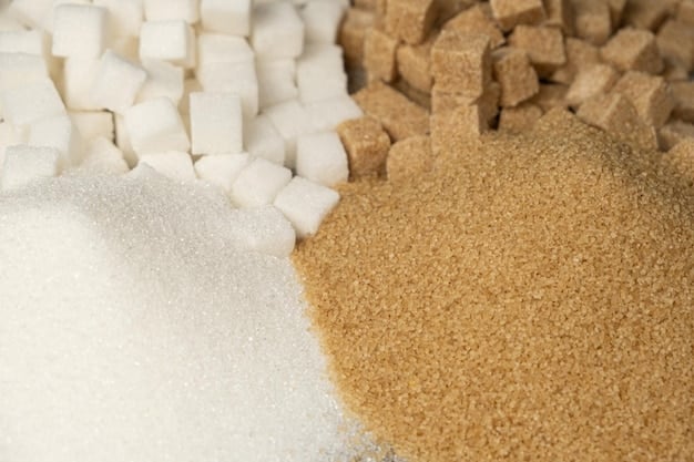 A close-up shot of a food label highlighting various forms of added sugar such as 