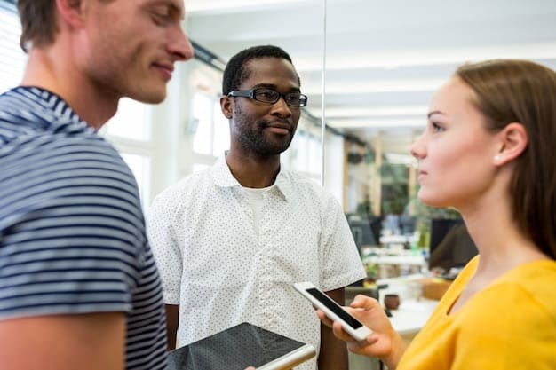 A diverse group of professionals networking at a career fair in Brazil, exchanging business cards and engaging in conversation, highlighting the importance of professional connections.