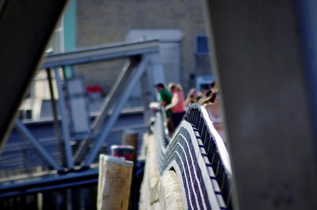 A close-up of construction workers pouring concrete on a new bridge pillar, highlighting the labor and materials involved in infrastructure projects.