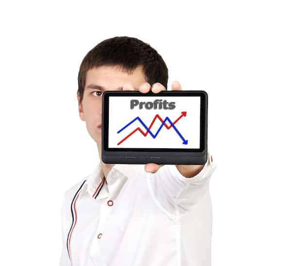 A person holding a financial chart, symbolizing investment and planning.