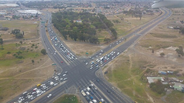 An aerial shot of a busy highway in Brazil, filled with trucks and cars, symbolizing the country's heavy reliance on road transportation and fuel consumption.
