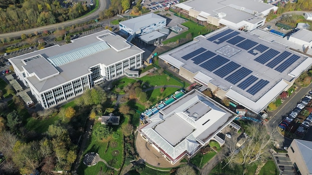 A manufacturing plant using solar panels on its roof, with a focus on renewable energy.
