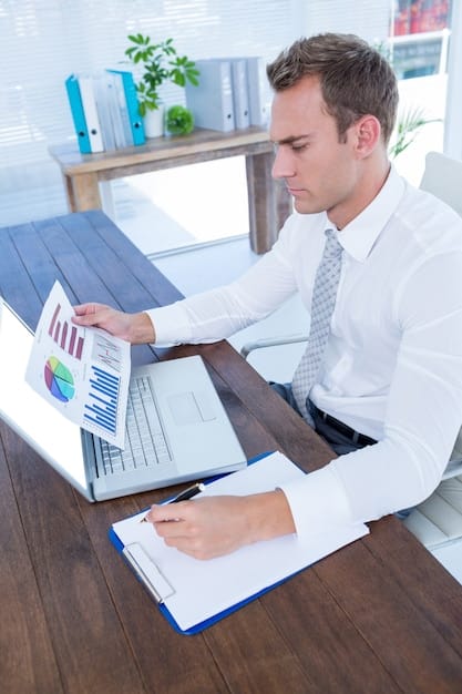 A focused image of an accountant working diligently on financial statements, highlighting loan conditions and interest rates on a computer screen. The scene captures the analytical work required to manage the financial implications of Selic.