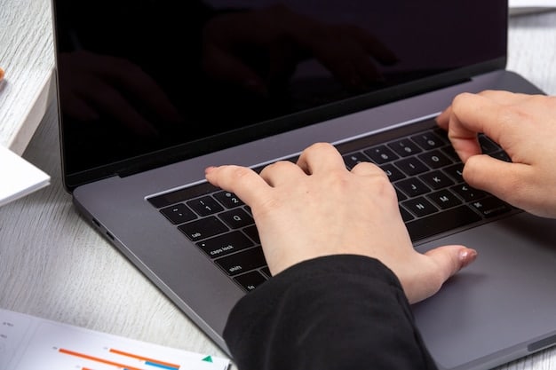 A close-up shot of hands typing on a laptop keyboard. The screen displays a dashboard with charts and graphs related to government spending and procurement data. The overall tone is professional and focused.