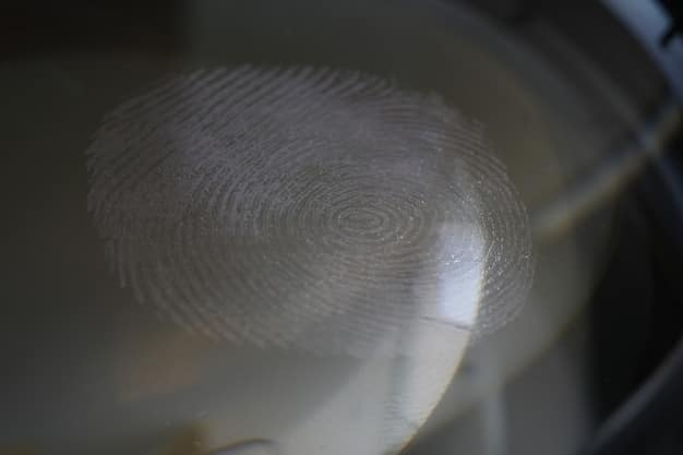 A close-up of a fingerprint being scanned on a digital device. The background is blurred and shows a corporate office setting.