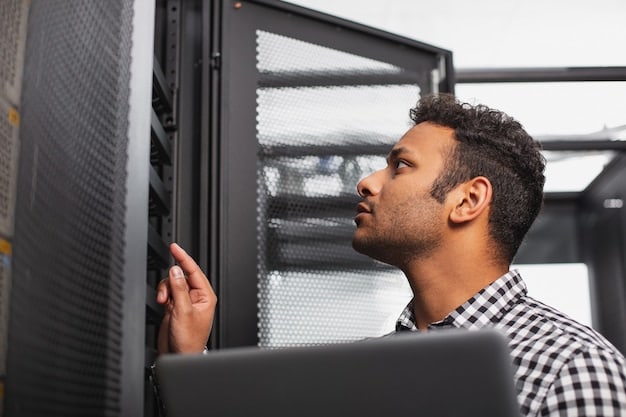 A technician working on a complex server rack in a data center. Focus on the intricate details of the equipment and the technician's focused expression.