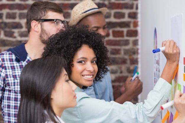 A diverse group of Brazilian professionals collaborating on a project in a co-working space in Rio de Janeiro, brainstorming ideas and writing on a whiteboard.