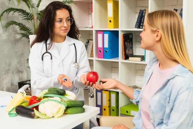 A person consulting a nutritionist while sitting at a desk. There are papers, fruits and vegetables on the desk. The nutritionist is explaining the benefits of various vitamins and minerals.