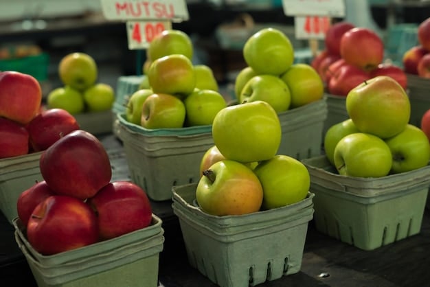 A close-up shot of a grocery store shelf displaying both organic and conventionally grown apples. The organic apples, though slightly pricier, are arranged attractively with clear labeling, emphasizing their natural and pesticide-free qualities. The lighting is bright and inviting, highlighting the fresh appearance of both options.