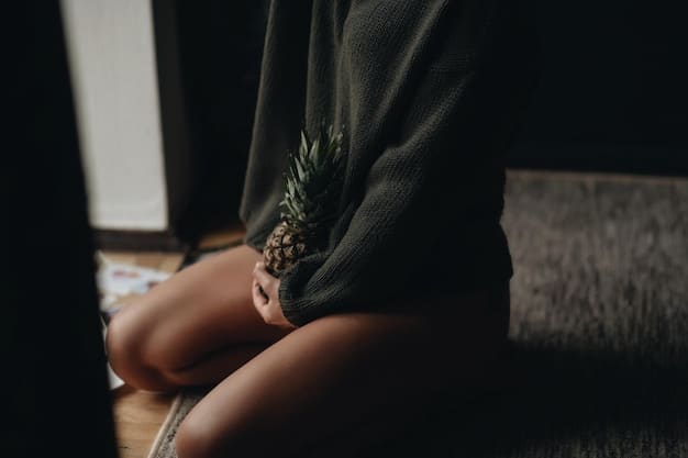 A close-up shot of a woman's hands gently resting on her knees while meditating. The background is blurred, focusing on the hands and the peaceful expression of the face. Warm, natural lighting enhances the sense of calmness and serenity.