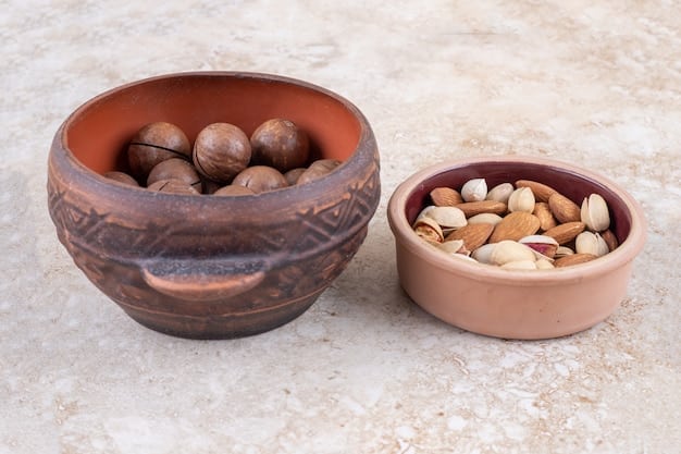 A close-up of a bowl filled with various types of nuts and seeds, such as almonds, walnuts, chia seeds, and flaxseeds. The image highlights the texture and colors of the nuts and seeds, emphasizing their health benefits for lowering cholesterol.
